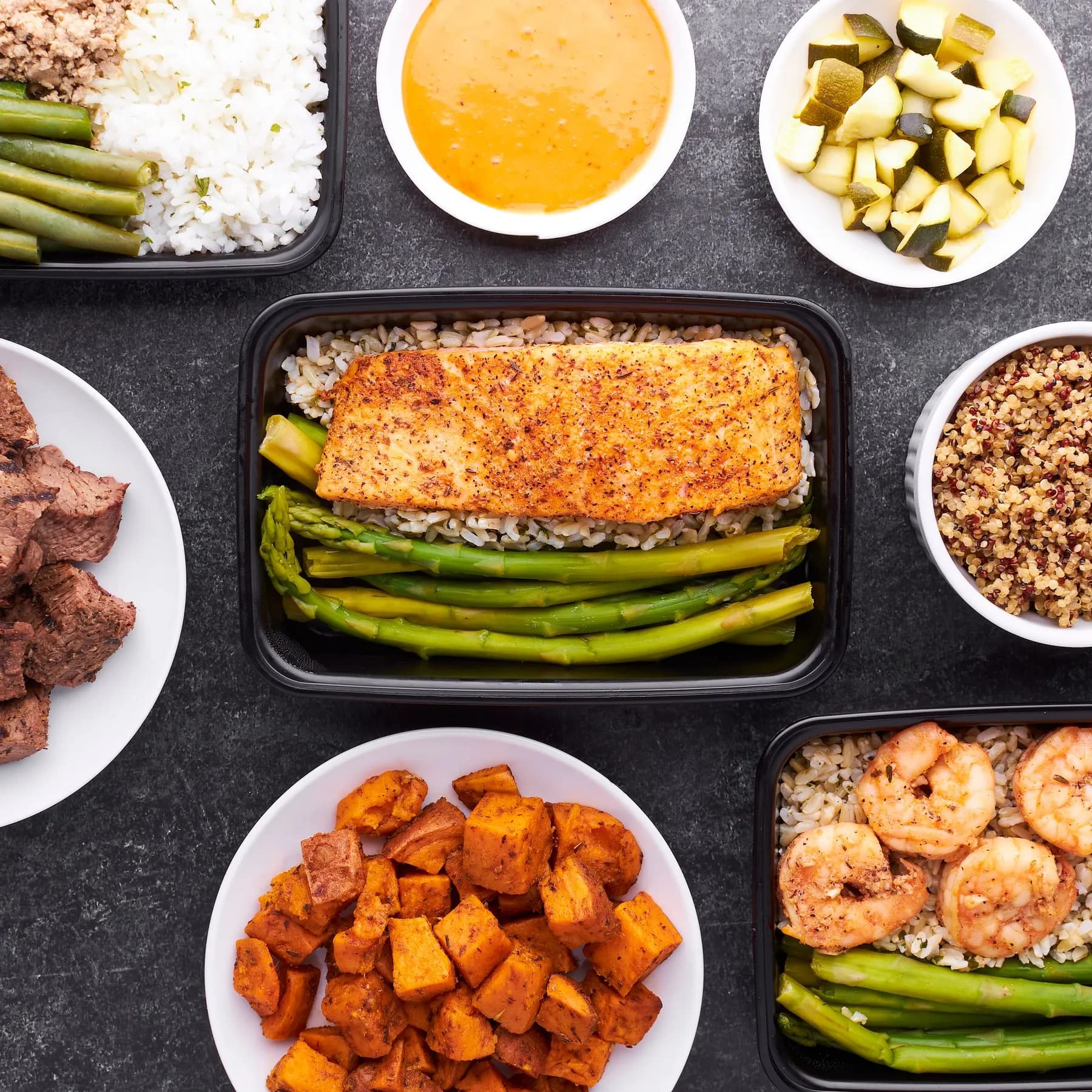 Meal prep boxes with salmon, rice and vegetables
